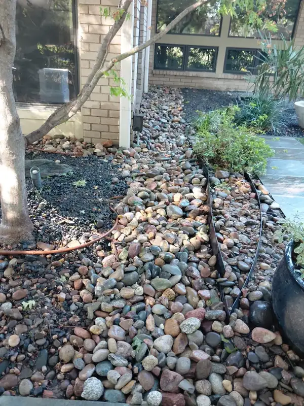 Stone covering the route of a residential drainage installation
